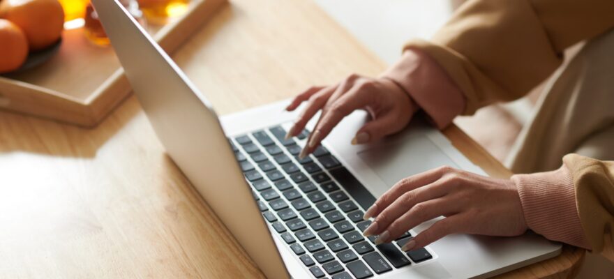 Woman working on laptop online